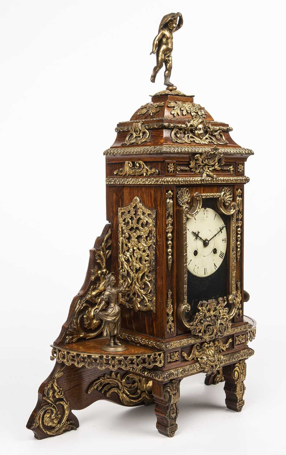 A late 19th century continental oak cased mantle clock with gilt metal figural decoration. 46cm wide - Image 2 of 4