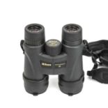 A pair of Nikon Monarch M511 10 x 42 5.5 degrees binoculars in original case with paper