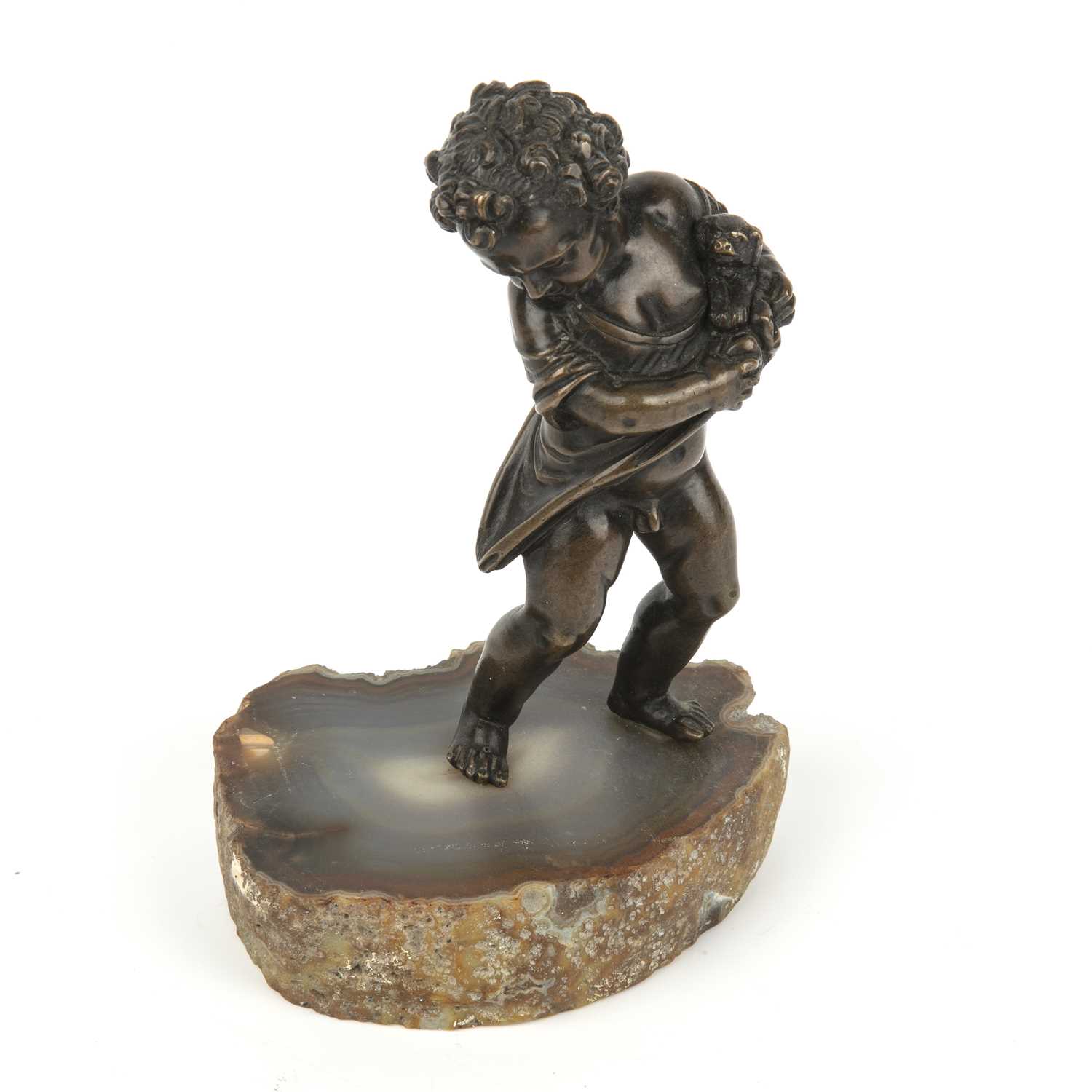 An 18th century bronze cherub with a small dog in its arms, mounted on a later agate slice, - Image 3 of 4