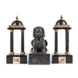 An Antique bronze sphinx on a hardstone base, 26cm wide x 12cm deep x 22cm high; together with a