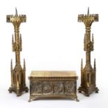 A pair of ecclesiastical gilt metal candle stands, 17cm wide x 60cm high; together with a gilt metal