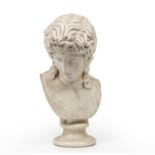 After the Antique: A 19th century white marble female head and shoulder bust 28cm wide 53cm high.