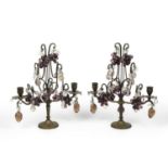 A pair of late 19th century continental gilt metal twin branch candelabra each with glass fruit