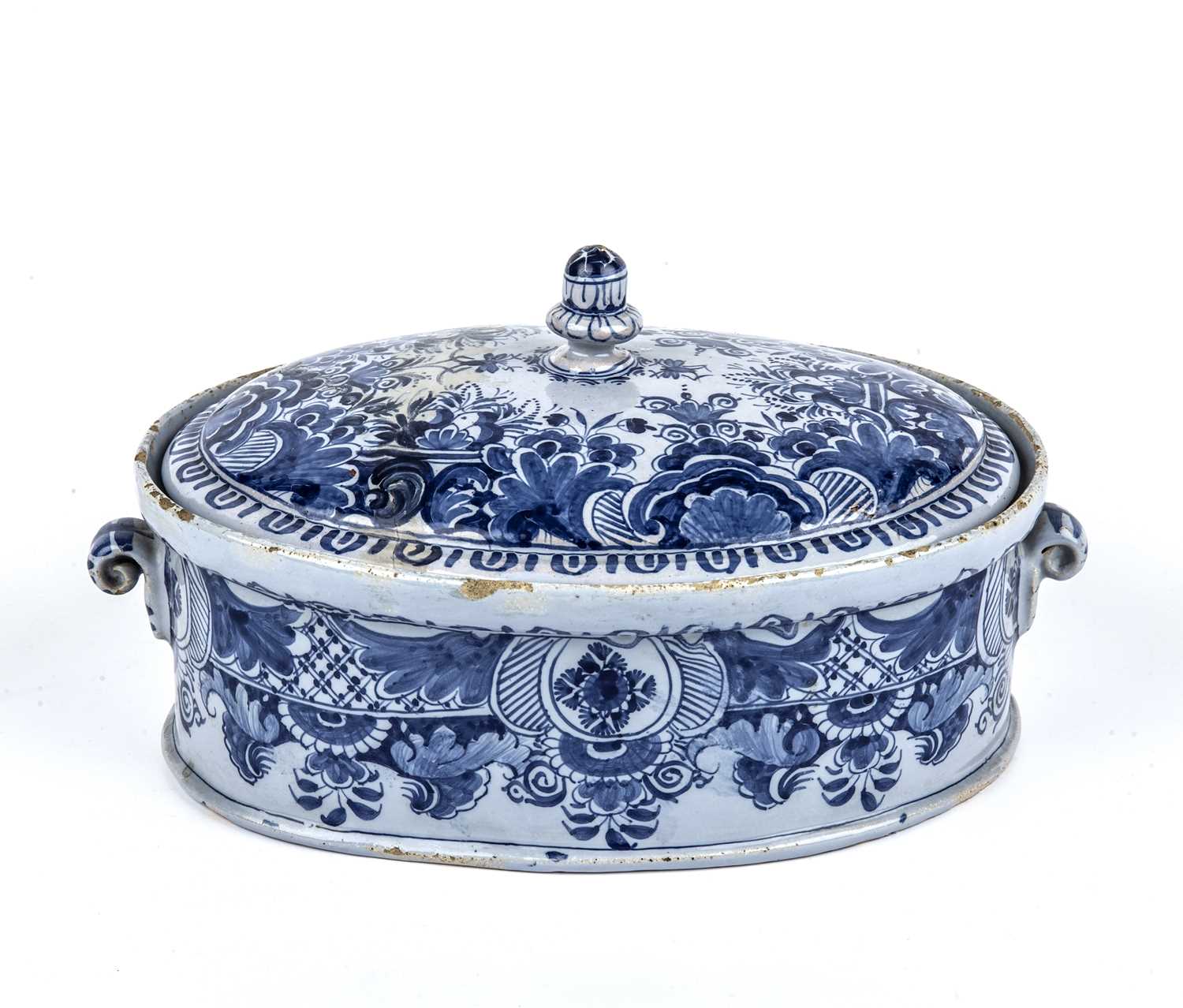 A mid 18th century blue and white Dutch Delft tureen and cover, 24cm wide x 13cm highRestored lid