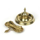 A pair of 18th century brass candle snuffers on a snuffer stand, the snuffers 13cm wide, the stand