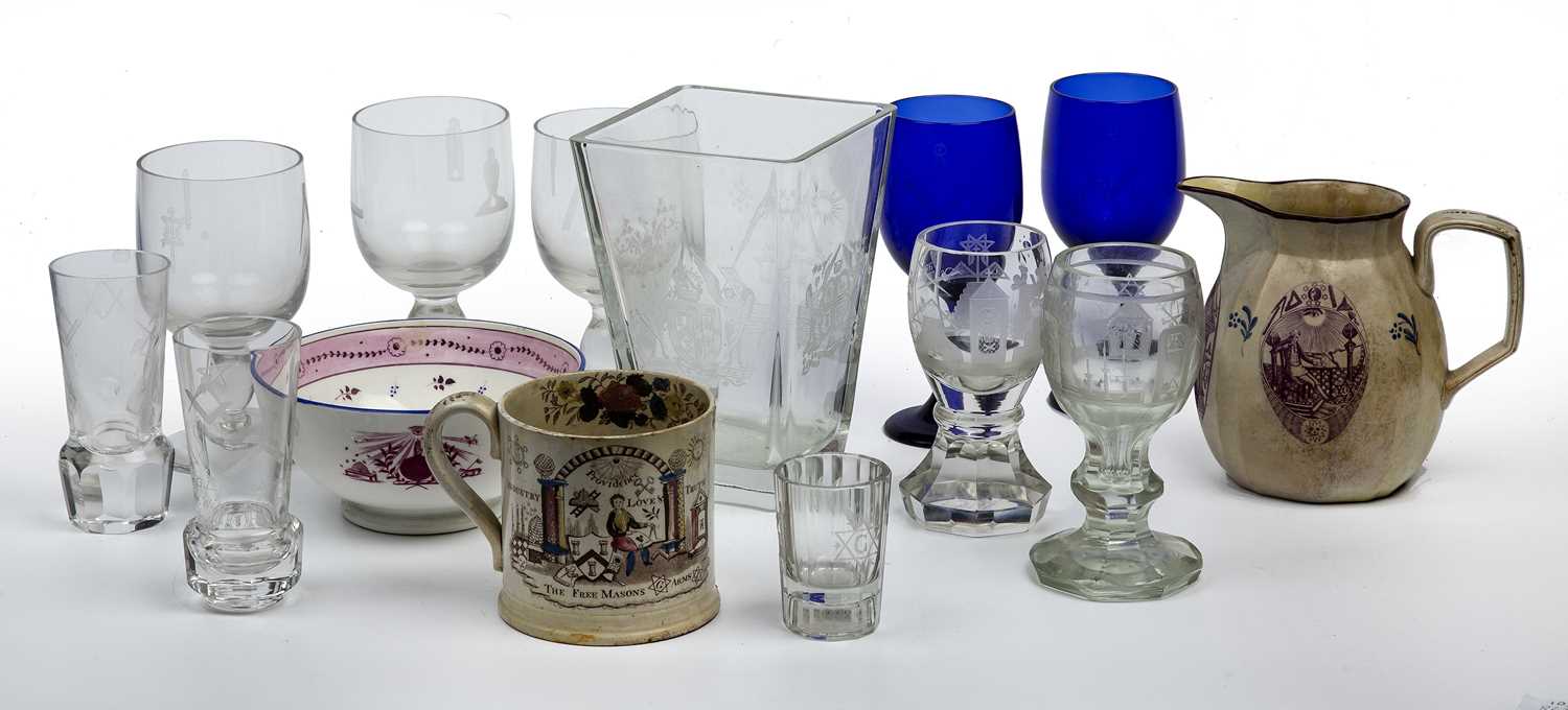 A group of Masonic related ceramics and glassware to include the 'Freemasons Arms' tankard, a jug