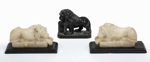 A pair of 19th century carved alabaster recumbent lions each 15cm in length x 8.5cm high together