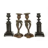 A pair of Regency bronze candlesticks on quadriform bases, raised on bun feet, 6.5cm wide x 17cm