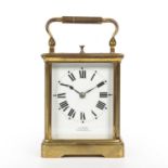 A Late 19th century French carriage clock with a white enamel roman dial inscribed J.C Vickery to
