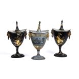 A pair of Regency toleware chestnut urns with chinoiserie gilded decoration and lions mask ring