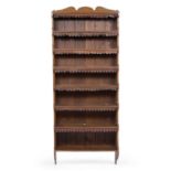 A late 19th century oak seven tier wall mounting book shelf 77cm wide x 20cm deep x 183cm highAt