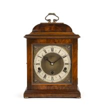 An early 20th century Elliott chiming clock with a walnut case, the silvered dial with Roman