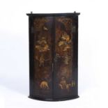 A Georgian chinoiserie lacquered bow front corner cabinet, 62cm wide x 37cm deep x 92.5cm high