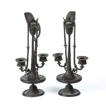 A pair of 19th century French bronze twin branch candlesticks of ewer form, each 33cm in heightAt
