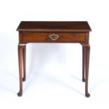 A George III mahogany single drawer side table with turned legs and pad feet, 75cm wide x 45cm