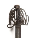 An unusual 18th-century Scottish sword with a curved blade, indistinctly stamped to the base of
