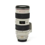 A Canon lens EF 70-200mm f/2.8 L IS USM with an ET-86 hood and caseCondition very good. No