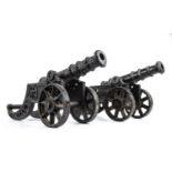 A pair of cast iron desk top cannons, each 15cm wide x 42cm long x 17cm high