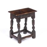 An 18th century oak joint stool with turned supports, 45cm wide x 31cm deep x 52cm high