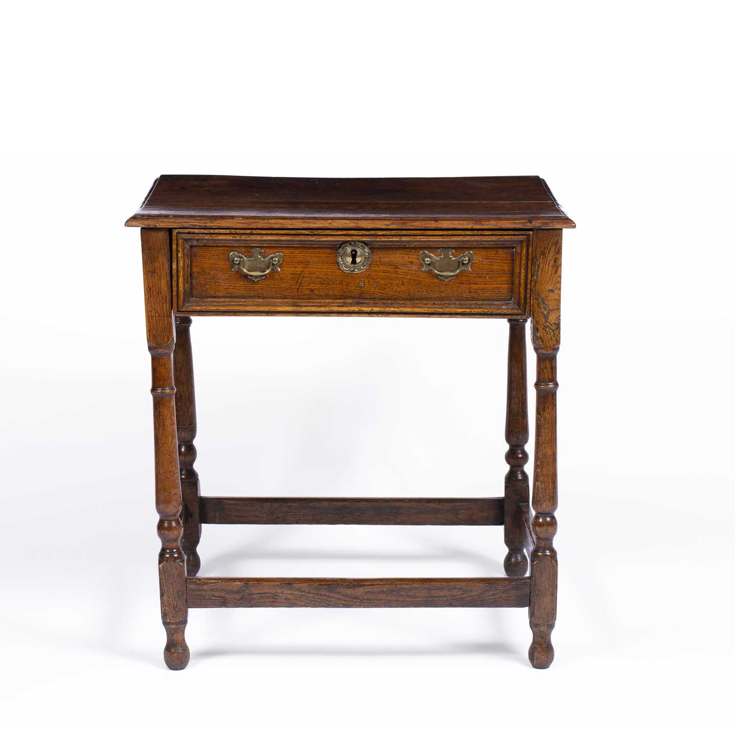 An 18th century oak single drawer side table with turned supports, 61cm wide x 47cm deep x 64cm