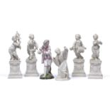 A group of four Nyphemburg porcelain cherub band figures 17cm high a Nymphenburg easten figure, no