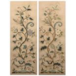 A pair of antique raised wool work floral pictures, each 89 x 32cmSlight discoloration due to age. A