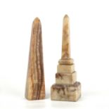 A Grand Tour style alabaster obelisk with a stepped base, 11cm wide x 11cm deep x 37cm high and a