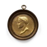 A 19th century gilt metal portrait medallion of Napoleon, by Claude Galle, with a label to the