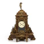 A late 19th century continental oak cased mantle clock with gilt metal figural decoration. 46cm wide