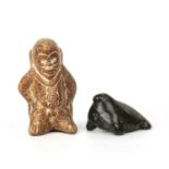 A pre-Columbian whistle figure of male form, 14cm in height together with an Inuit carved