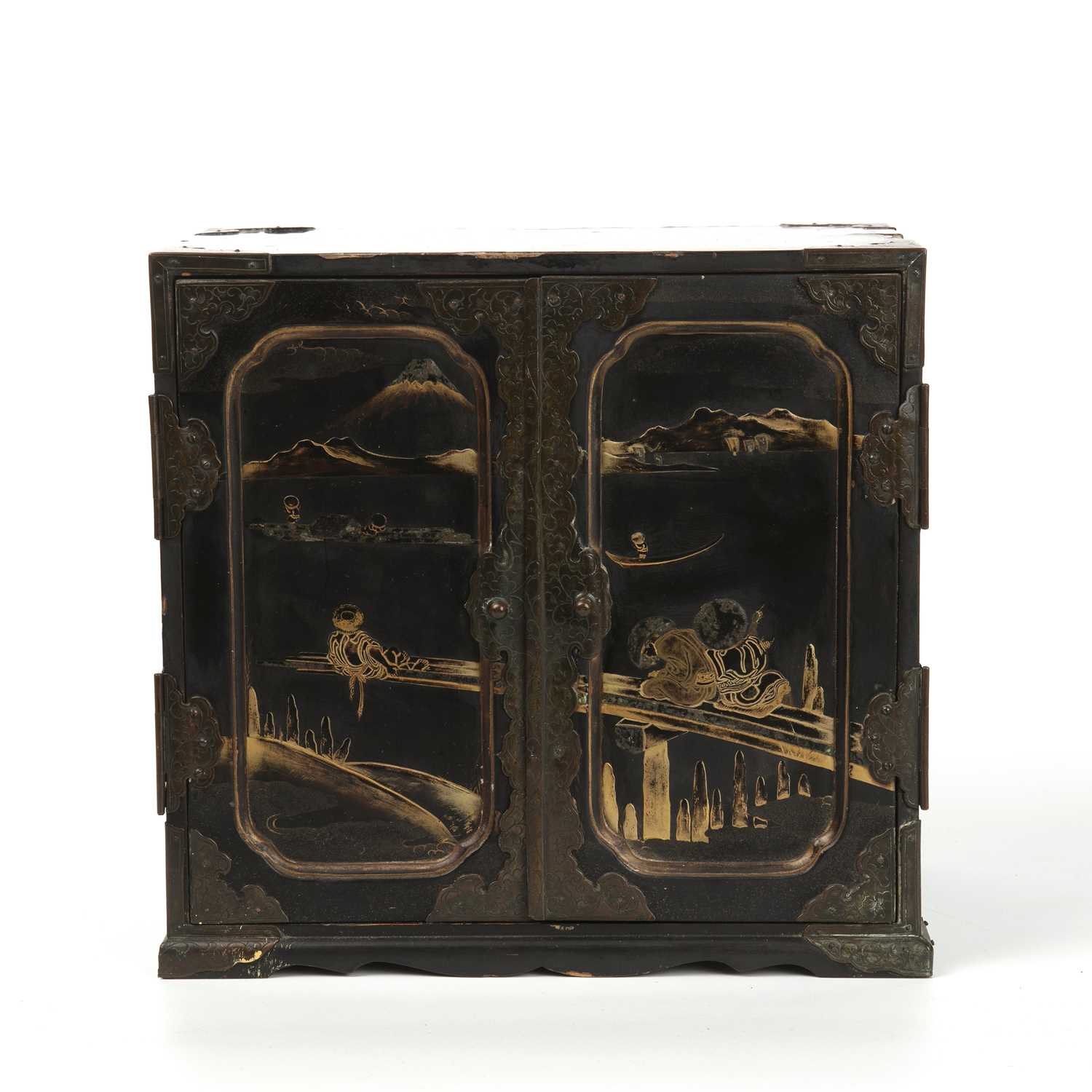 An antique Japanese lacquered table cabinet with gilded decoration, twin panelled doors opening to - Image 2 of 6