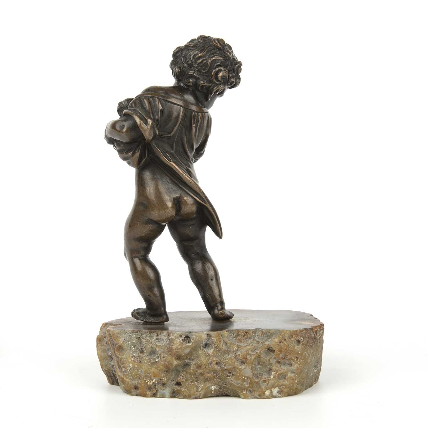 An 18th century bronze cherub with a small dog in its arms, mounted on a later agate slice, - Image 2 of 4