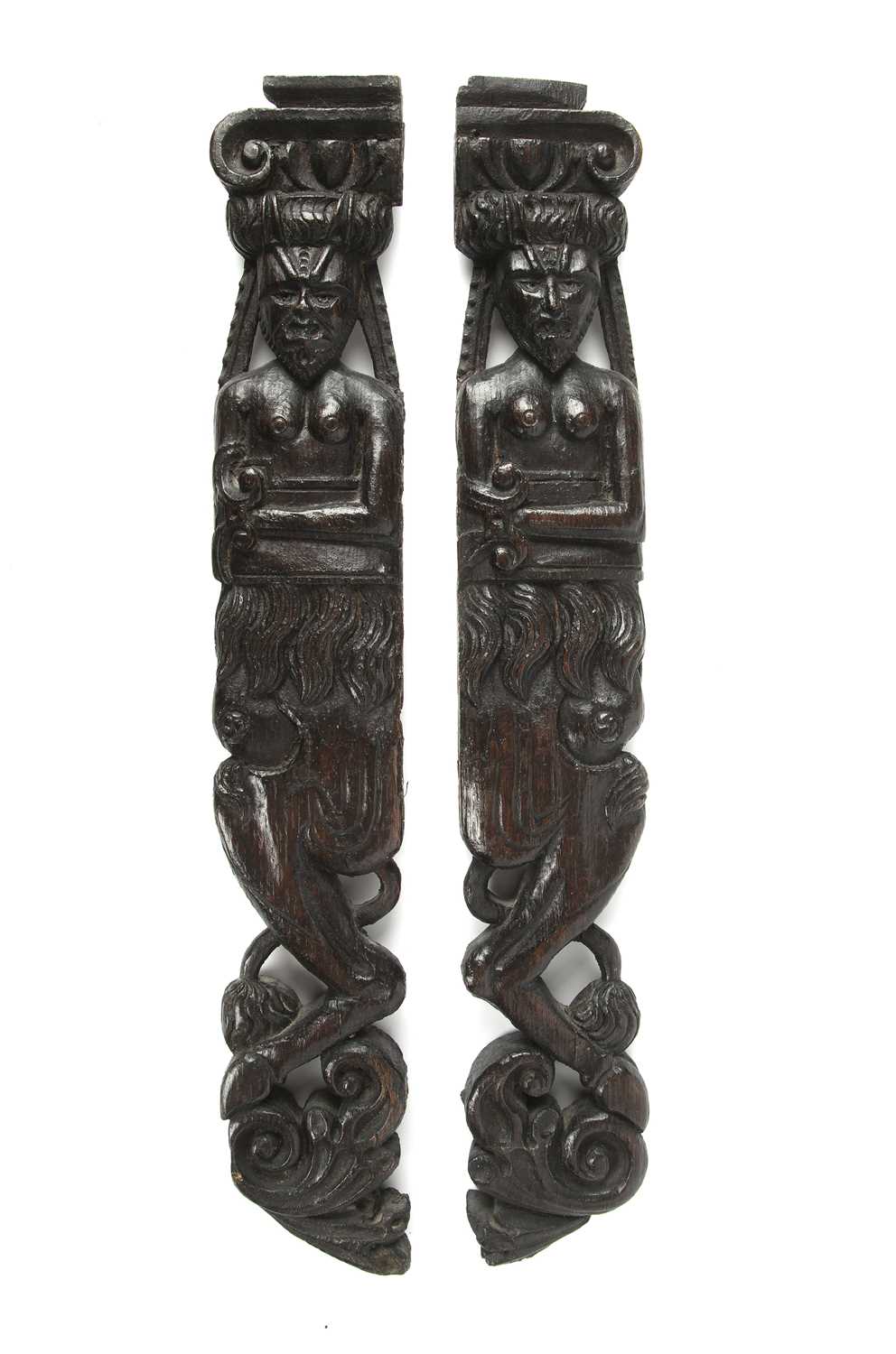 A pair of antique early English carved oak terms each 8cm wide x 50cm in lengthIn good condition,