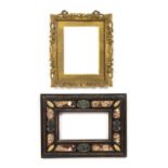 A 19th century continental ebonised wooden picture frame with marble inlaid decoration, 27.5cm x