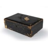 A mid 19th century black leather bound dispatch box with a brass swan neck carrying handle and a