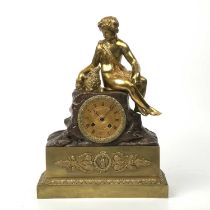 A 19th century French bronze and gilt metal figural mantle clock with a shepherd and a sheep, the
