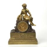 A 19th century French bronze and gilt metal figural mantle clock with a shepherd and a sheep, the