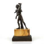 A late 18th / early 19th century bronze Grand Tour model of a youth carrying a goat, after the