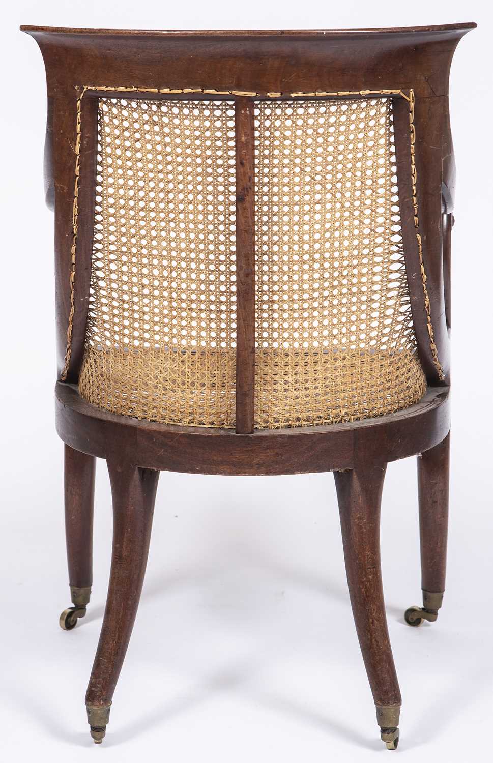 A Regency mahogany bergere library open armchair with a caned back and seat, scrolling arms, sabre - Image 3 of 11