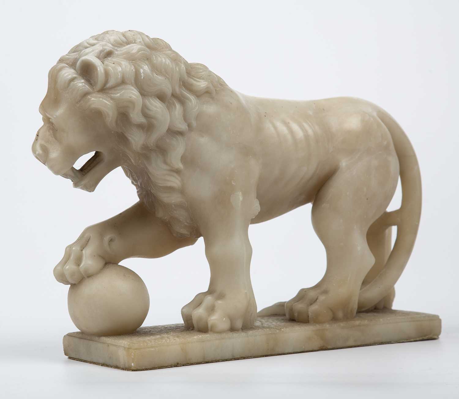 A late 18th/early 19th century carved alabaster lion 35cm wide x 25cm highSome hairline cracks to - Image 3 of 4