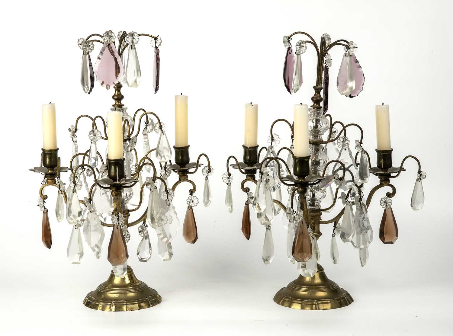 A pair of late 19th century French gilt metal three branch candelabra with cut glass drops, 29cm