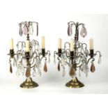 A pair of late 19th century French gilt metal three branch candelabra with cut glass drops, 29cm