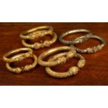 A collection of four pairs of Indonesian style anklets