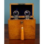 A Victorian oak decanter case and two cut class decanters