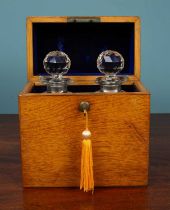 A Victorian oak decanter case and two cut class decanters