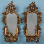 A pair of possibly Continental carved gilt wooden gesso wall sconces