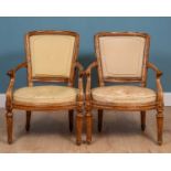 A pair of continental chestnut armchairs