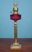 A Victorian oil lamp later converted for use an an electric table lamp