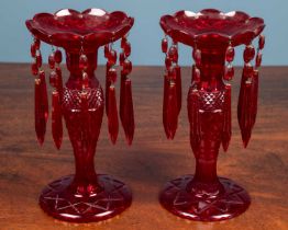A pair of ruby glass lustres