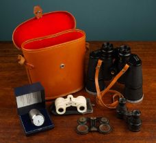 A collection of three sets of opera glasses and a Swiss Quartz watch